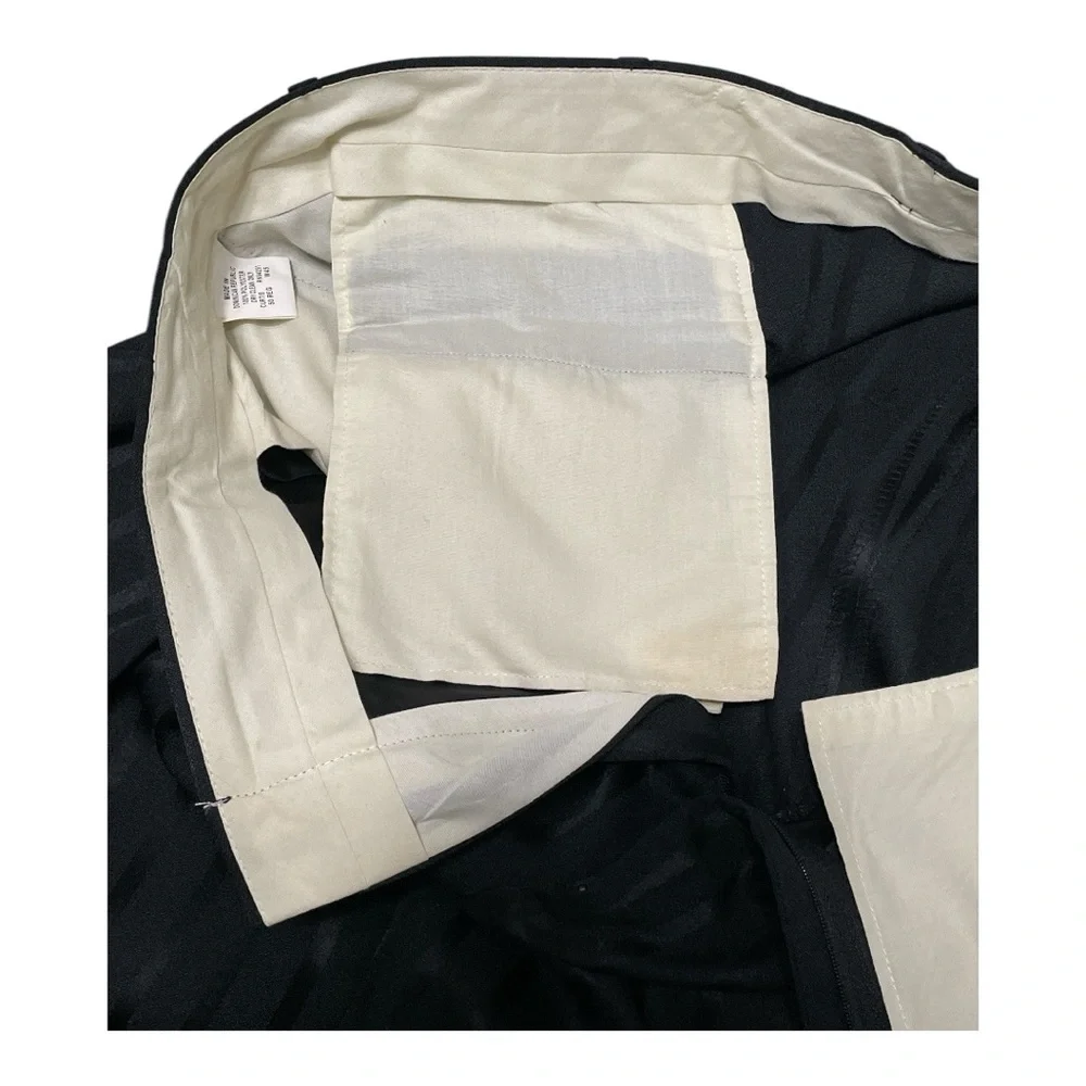 Classic Falcons Four-Button Black Suit with Subtle Pinstripes and Notched Lapels